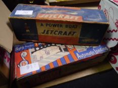 Vintage Jetcraft power boat in original box together with an automatic loading target game (2)