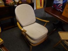 Ercol elm armchair and a spindle back Windsor shape side chair