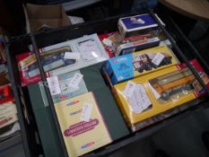 Crate containing a collection of boxed model vehicles including Corgi and Dinky