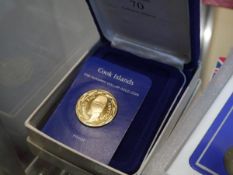 A Franklin Mint Cook Islands 100 dollar gold coin, "The Mask of Tangaroa". boxed with certificate.