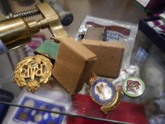 Bag containing a collection of miscellaneous lighters, commemorative coins, and a Royal Air Force