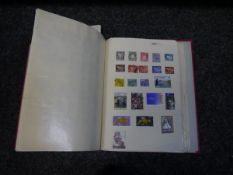 Old European stamp collection on red simplex album