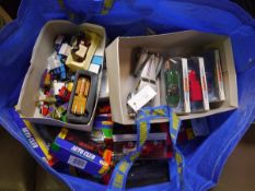 Bag containing a collection of die cast car models including Matchbox Dinky Sports Champions