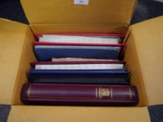 Box containing old Strand stamp album, another album with Great Britain mint, two stock albums of