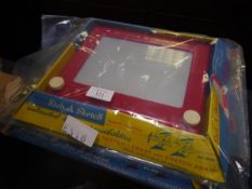 Two vintage etch-a-sketch magic screen games complete with original packaging, and a remote