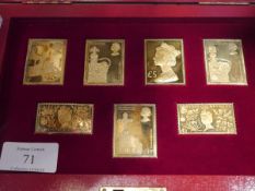 A cased set of seven silver-gilt commemorative replica stamps, 25th anniversary of the Coronation,