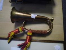 A copper and brass military bugle applied with the badge of the Argyll & Sutherland Highlanders