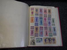 Old overseas stamp collection in red Simplex album