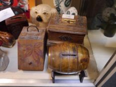 Collection of treen money banks including miniature whisky barrel and coal scuttle