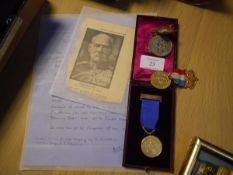 A Marylebone Rifle Club gilt-metal medal dated 1909, "The Viscount Portman Challenge Shield", in its