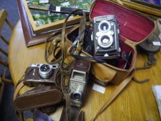 Collection of vintage camera equipment including Zorki-6 camera in case, The G B Bell and Howell 624
