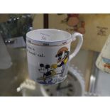 A 1930's Paragon China Mickey Mouse cup, printed of an image of Mickey holding a pop gun and the