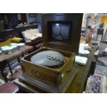 Marquetry inlaid walnut Polyhphon, late 19th century, the table top musical disc player playing from