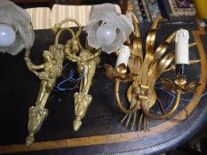 Pair of figural gilt-metal wall lights, in the Belle Epoque taste, each cast with a putto holding