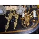 Pair of figural gilt-metal wall lights, in the Belle Epoque taste, each cast with a putto holding