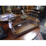 William IV rosewood book trough, c. 1835, the rectangular platform with gadrooned border and