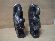 A pair of Chinese carved soapstone bookends, early 20th century, modelled as birds of toucan type.