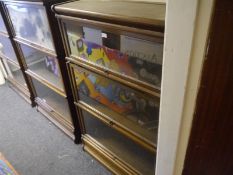 Globe Wernicke oak sectional bookcase, of characteristic form, with three sections, bearing maker'