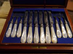 Cased set of twelve Victorian mother of pearl handled fruit knives and forks, silver blades and