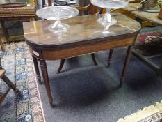 19th century mahogany foldover tea table, with rounded corners, raised on ring-turned legs. 0.72m by