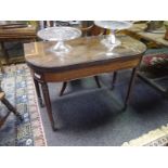 19th century mahogany foldover tea table, with rounded corners, raised on ring-turned legs. 0.72m by
