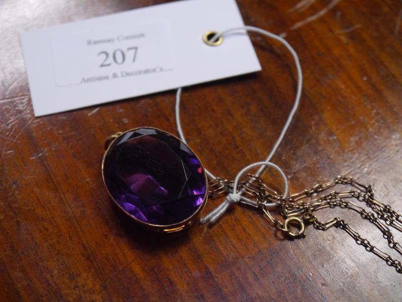 Large oval-cut amethyst pendant, late 19th century, the stone in an (unmarked) gold mount, on a