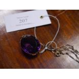 Large oval-cut amethyst pendant, late 19th century, the stone in an (unmarked) gold mount, on a