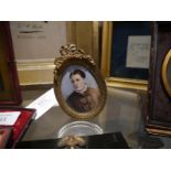 19th century portrait miniature of a lady, bearing cypher GE, watercolour on ivory, within a