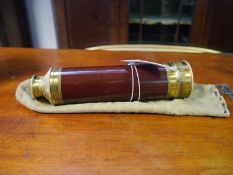 Brass and mahogany five draw telescope, c. 1900, in its original kid bag, unnamed. Extended c. 70cm