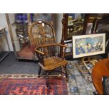 Elm Windsor armchair, mid-19th century, with pierced scroll-carved splat above a dished seat, raised