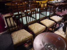 Set of four 19th century inlaid mahogany dining chairs, each with reeded splats above a drop-in