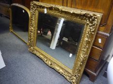 Large 19th century gilt-composition picture frame, elaborately moulded with shells, c-scrolls and
