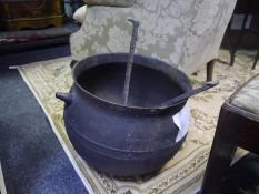 18th century iron cauldron, of circular bellied form, together with a pair of iron fire dogs of