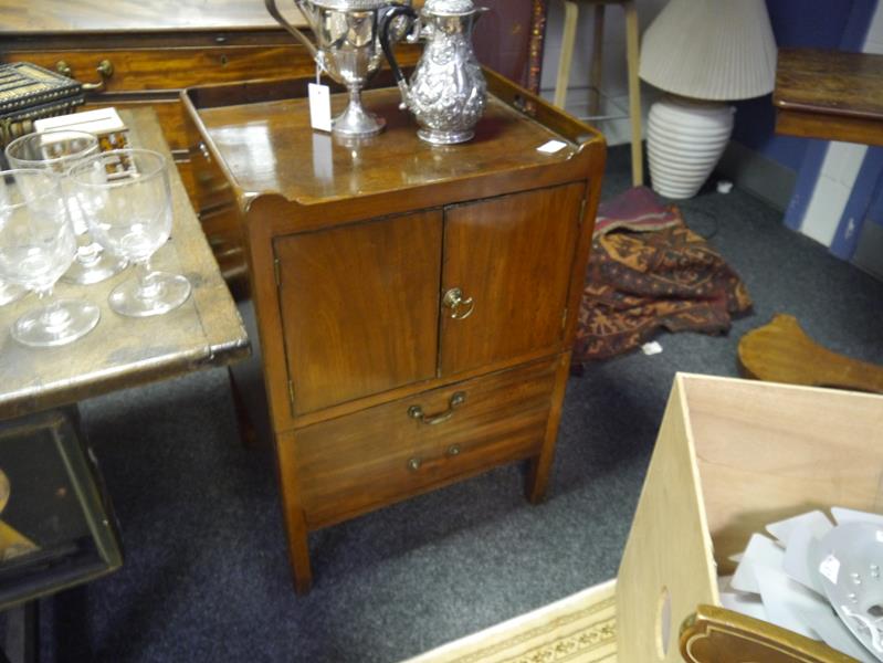 George III mahogany commode cupboard, the rectangular galleried top above a pair of cupboard doors