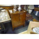 George III mahogany commode cupboard, the rectangular galleried top above a pair of cupboard doors