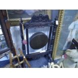 Late Victorian oak framed dinner gong, with scroll and leaf carved crest, baluster uprights and