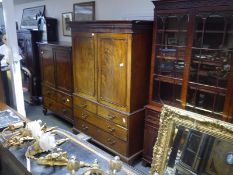 George III mahogany linen press, with dentil carved moulded cornice above a pair of fielded panel