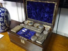 Victorian rosewood toilet box, the fitted interior with lift-out tray and secret drawer,