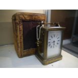 French late 19th century brass-cased carriage clock, the white enamel dial with Roman numerals, in