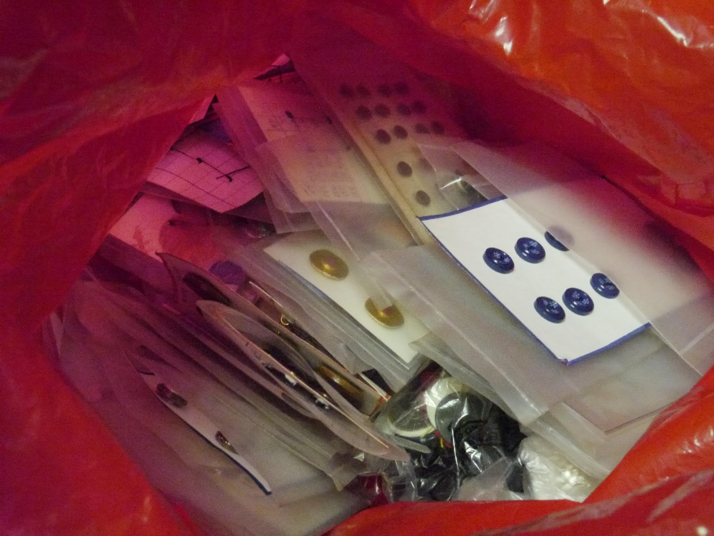 A large bag of mid and late 20th century plastic and metal buttons