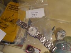 A Bulova diamond-set white metal lady's wristwatch, the mother of pearl dial with diamond set