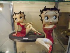 Two Betty Boop composition figures, each in a red dress