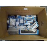A box containing approximately forty boxed Marklin HO gauge rolling stock including car transporter,