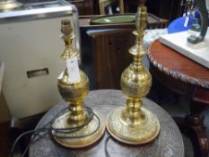 A pair of cast brass baluster table lamps in the Oriental taste