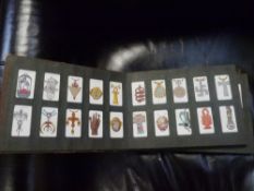 An album of 1920s/30s cigarette cards including Wills, John Player etc, various subjects including