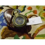 A World War I brass prismatic compass Verners Pattern VIII with arrow mark and dated 1917 in a