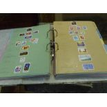 A collection of world stamps in two file folders (49)