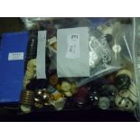 A box containing a quantity of plastic, faux horn and other buttons together with a bag of