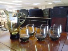 A vintage smoky glass lemonade set of jug and six tumblers