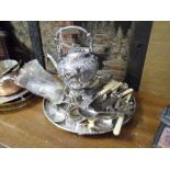 A Victorian silver plated hot water kettle on stand together with a group of silver plated